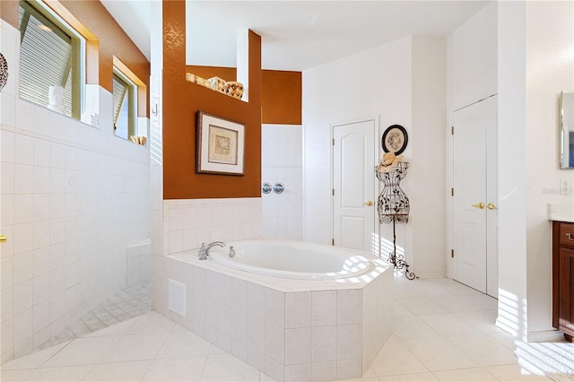 bathroom featuring shower with separate bathtub, tile patterned flooring, and vanity