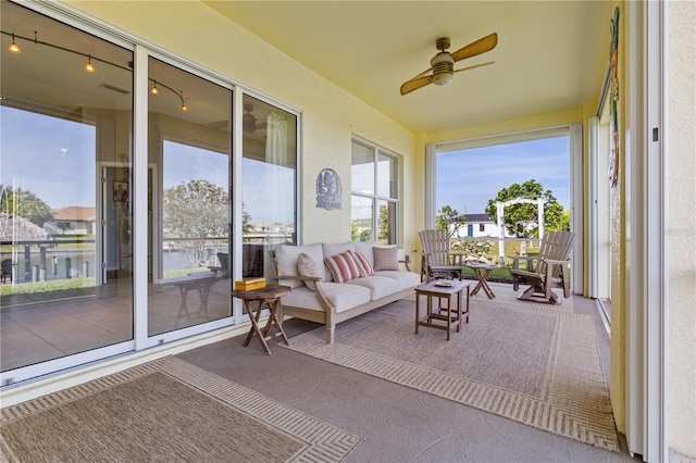 sunroom / solarium with ceiling fan and plenty of natural light