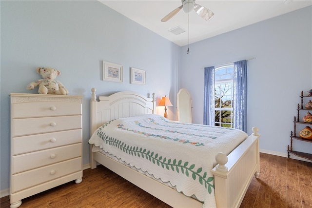 bedroom with dark hardwood / wood-style floors and ceiling fan