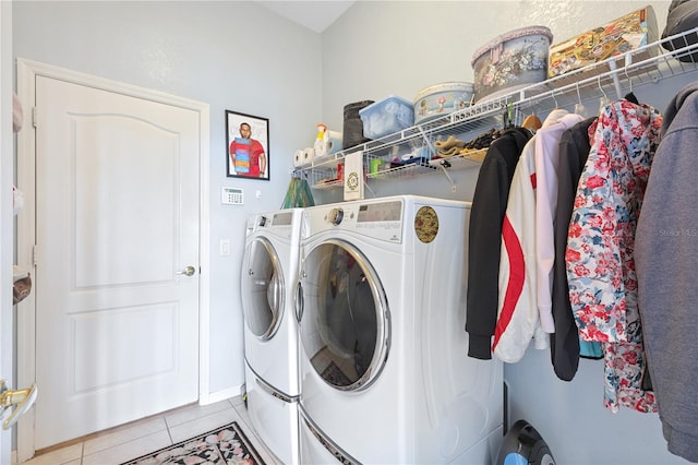 laundry area featuring independent washer and dryer and light tile patterned flooring