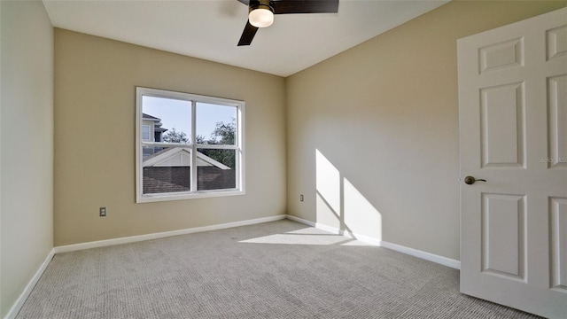 unfurnished room with ceiling fan and light colored carpet