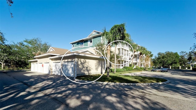 view of side of home featuring a garage