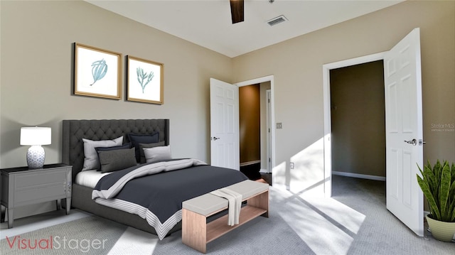 bedroom featuring light colored carpet and ceiling fan