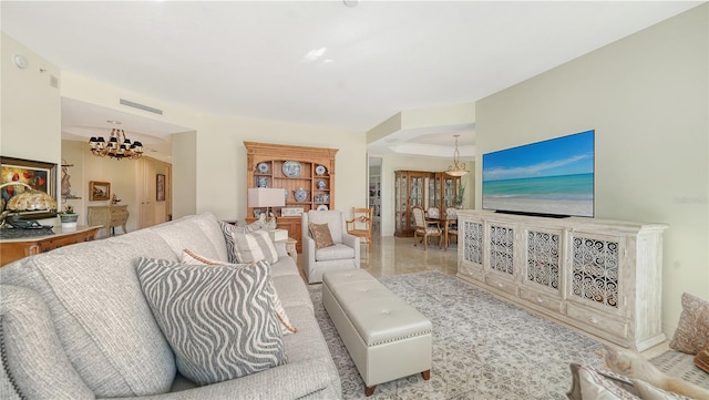 living room with an inviting chandelier