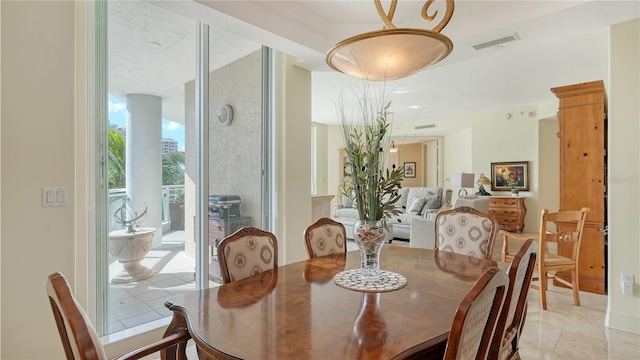 dining room with light tile patterned flooring