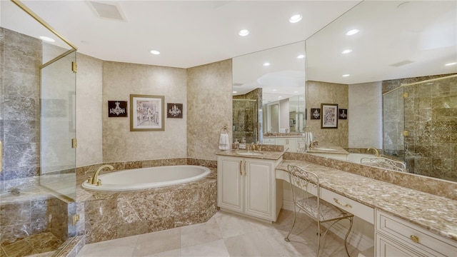 bathroom with vanity and separate shower and tub