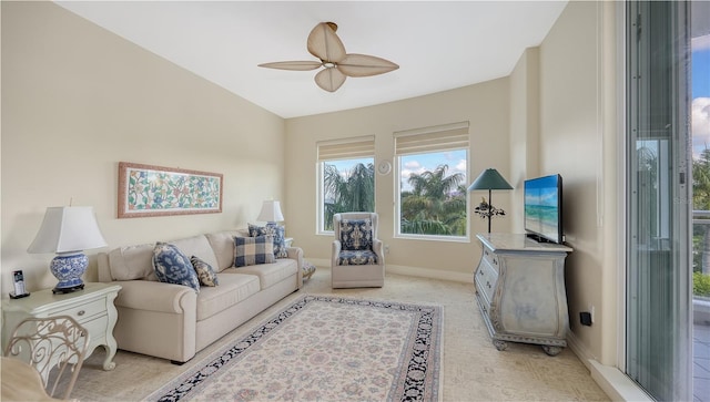 living room featuring light colored carpet, vaulted ceiling, and ceiling fan