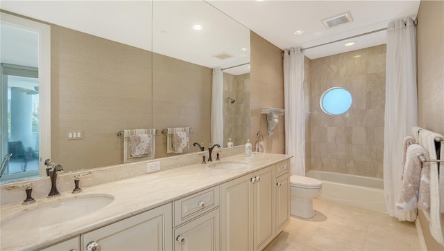 full bathroom with vanity, tile patterned floors, toilet, and shower / bathtub combination with curtain