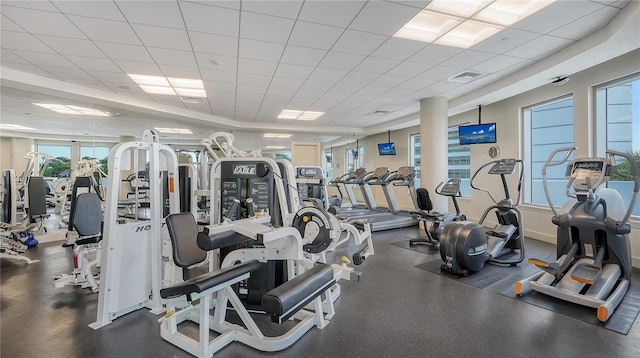 workout area featuring a paneled ceiling