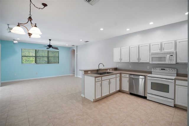 kitchen featuring white cabinetry, white appliances, and sink