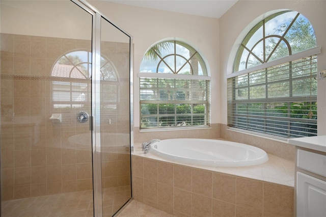 bathroom with vanity and plus walk in shower