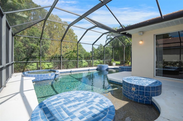 view of pool featuring a lanai, an in ground hot tub, and a patio area