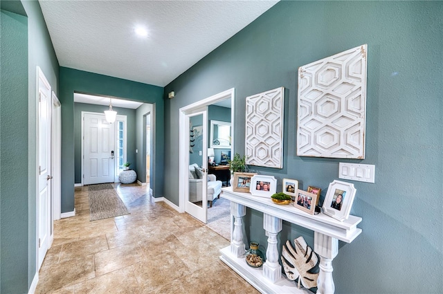 entryway featuring a textured ceiling