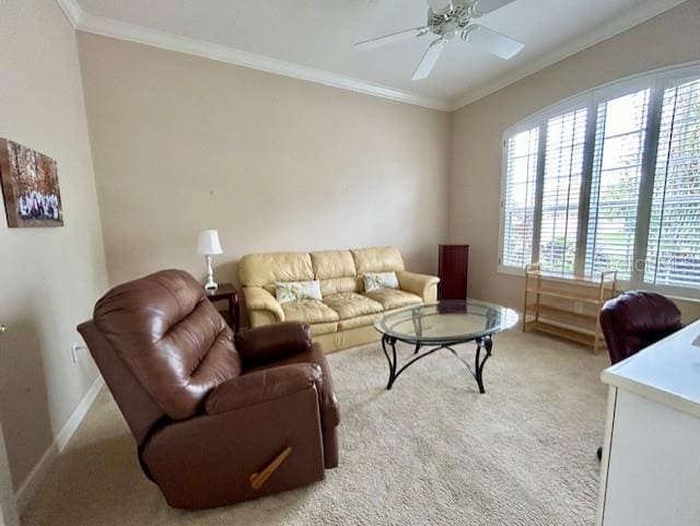 carpeted living room featuring crown molding and ceiling fan