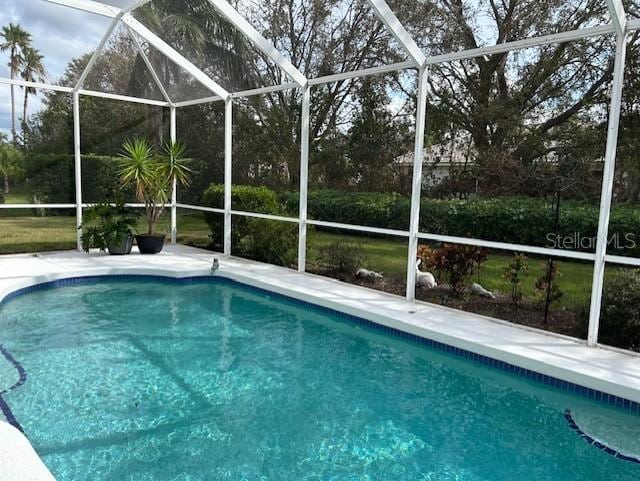 view of pool with a lanai