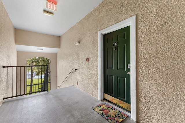 entrance to property featuring a balcony