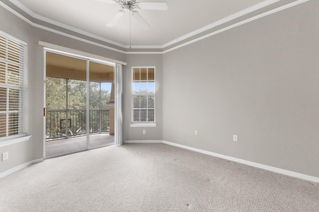 unfurnished room featuring ceiling fan, plenty of natural light, and carpet flooring