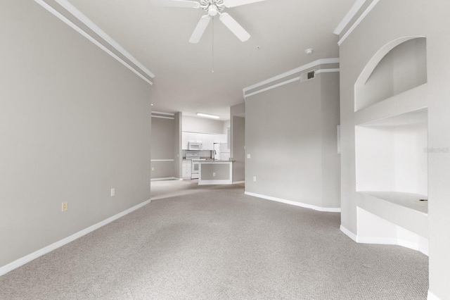 unfurnished living room with light carpet and ceiling fan