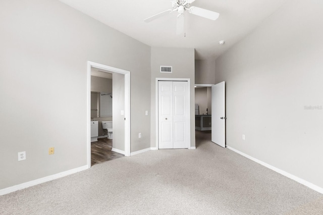 unfurnished bedroom featuring ceiling fan, carpet floors, and ensuite bathroom