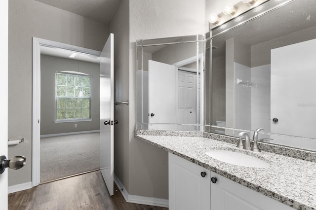 bathroom featuring vanity and hardwood / wood-style flooring