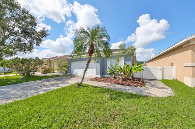 view of front of property featuring a front yard and a garage