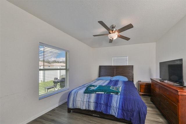 bedroom featuring a textured ceiling, hardwood / wood-style floors, and ceiling fan