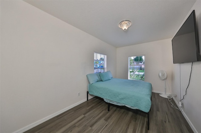 bedroom featuring dark wood-type flooring