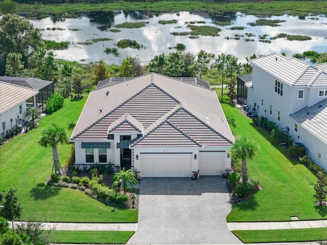 birds eye view of property with a water view