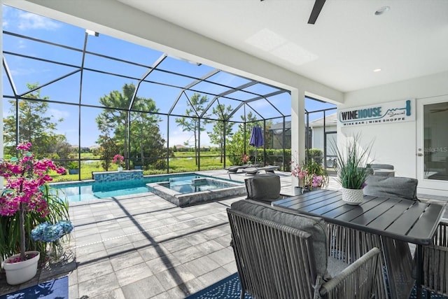 view of swimming pool with a lanai, an in ground hot tub, and a patio