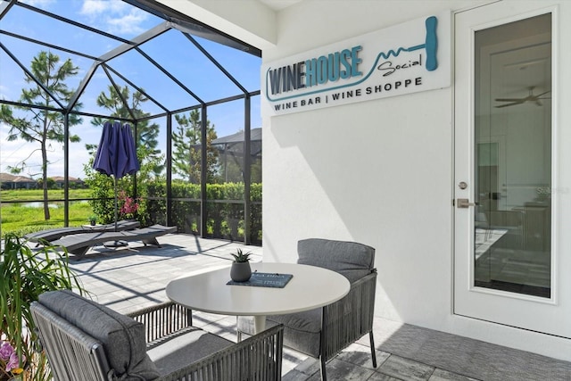 view of patio featuring a lanai