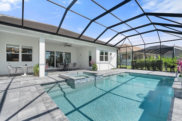 view of pool with an in ground hot tub, a patio area, ceiling fan, and a lanai