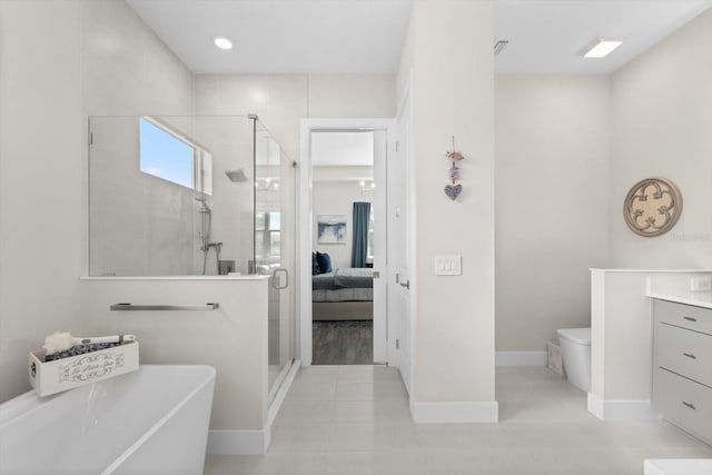 full bathroom with shower with separate bathtub, vanity, toilet, and tile patterned floors