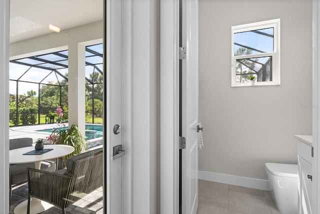 doorway to outside with light tile patterned floors