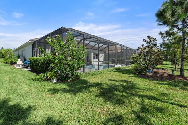 view of yard featuring glass enclosure