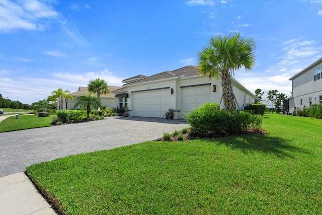 exterior space featuring a lawn and a garage