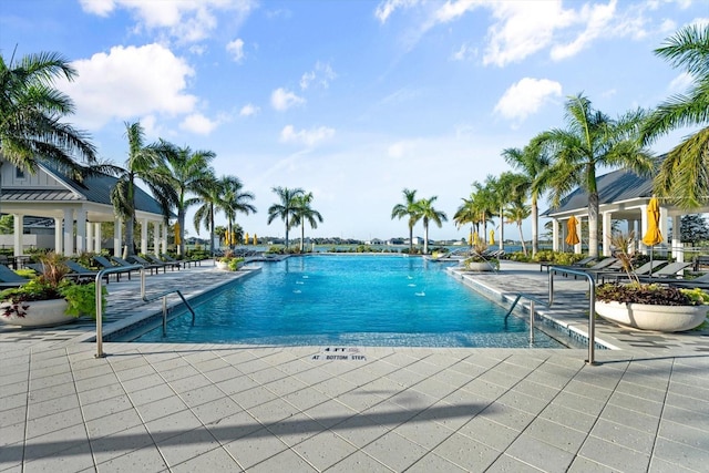 view of swimming pool with a patio