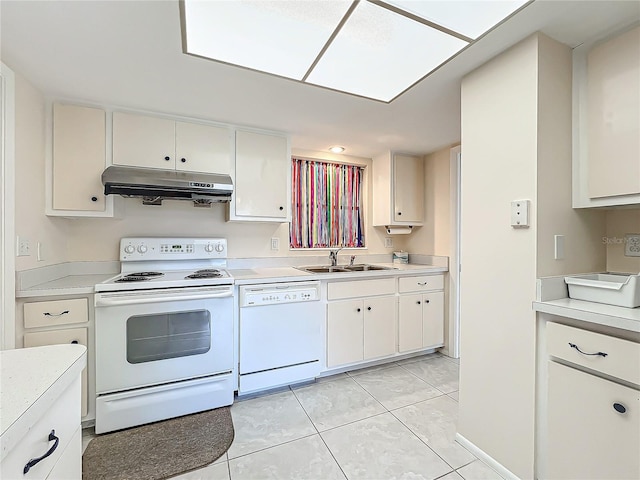 kitchen with light tile patterned flooring, white cabinetry, white appliances, and sink