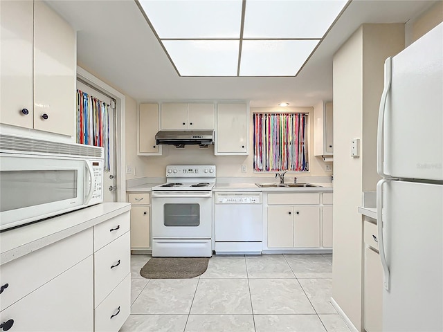 kitchen featuring light tile patterned flooring, white cabinetry, white appliances, and sink