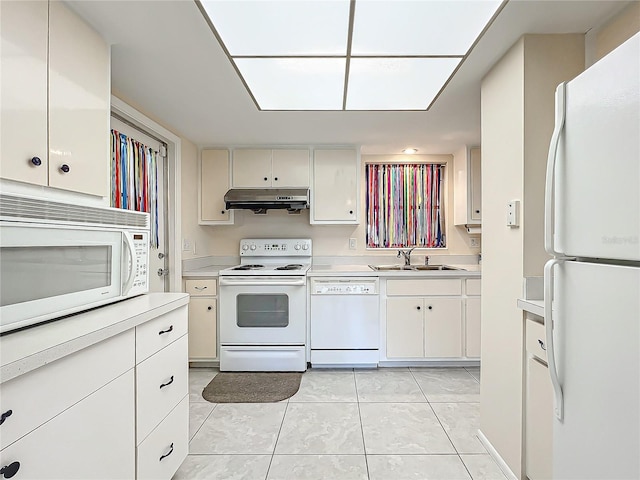 kitchen featuring a sink, white appliances, light countertops, under cabinet range hood, and light tile patterned floors