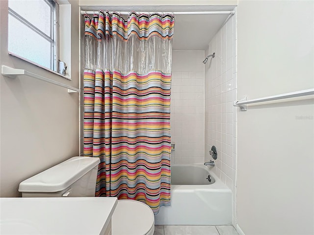 full bathroom featuring shower / bath combination with curtain, vanity, tile patterned flooring, and toilet