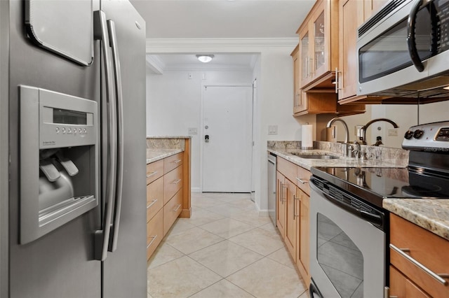 kitchen with light tile patterned floors, stainless steel appliances, glass insert cabinets, ornamental molding, and a sink