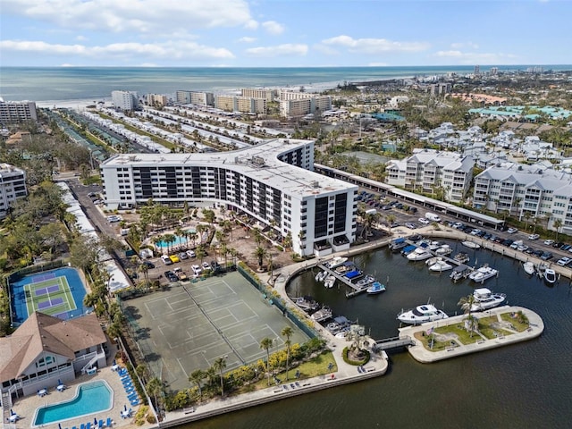 bird's eye view featuring a water view and a city view