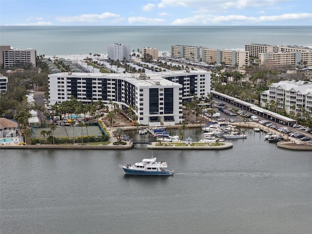 birds eye view of property featuring a water view and a city view