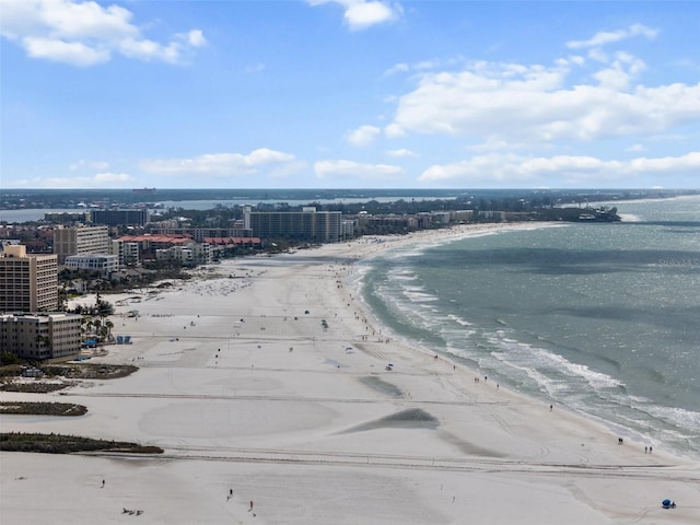 bird's eye view with a water view, a city view, and a view of the beach