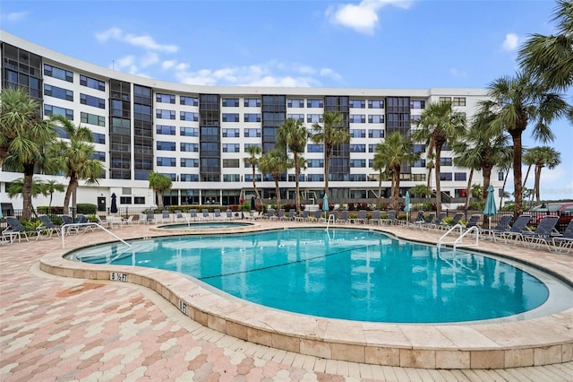 pool featuring a patio area and a community hot tub