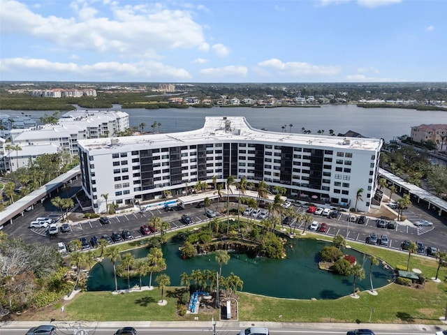 birds eye view of property featuring a water view