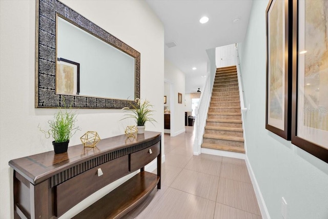 corridor featuring light tile patterned floors