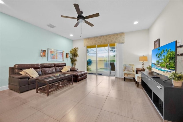 living room with light tile patterned floors and ceiling fan