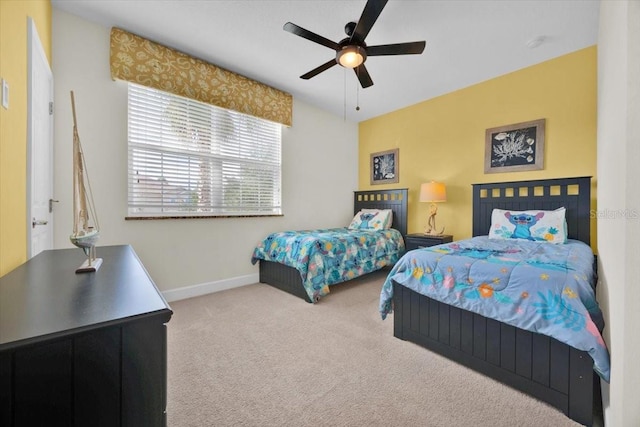 bedroom with ceiling fan and carpet