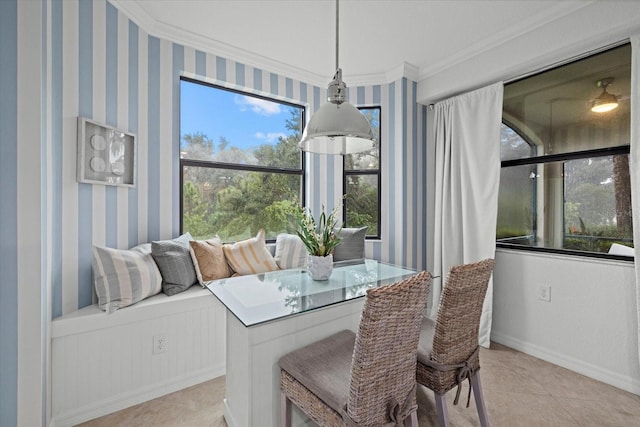 dining area with ornamental molding and light tile patterned floors